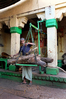 Weigher of wood for cremations, Varanasi, Uttar Pradesh